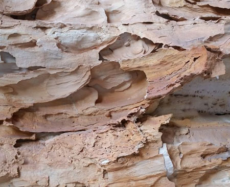 Natural sandstone etched by water and wind.