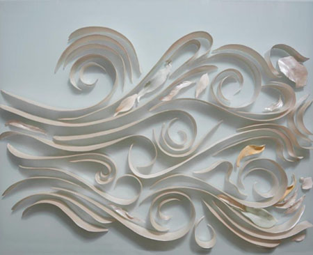 The first panel in a large five-panel ceramic artwork on glass. Ceramic ribbons, leaves and pebbles mimic the flow of water in a monsoon vine forest.