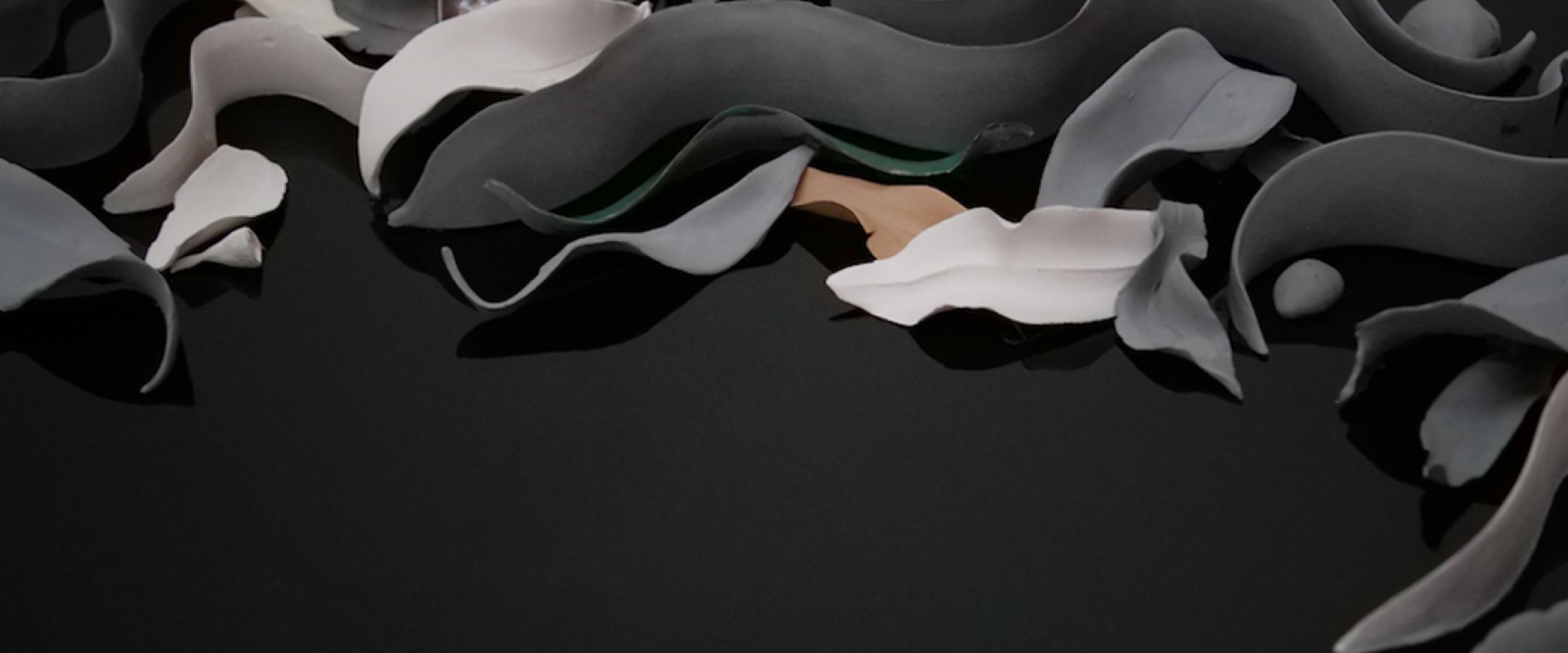 Closeup of ceramic leaves in artwork called 'Eternity' by Maria Kraatz